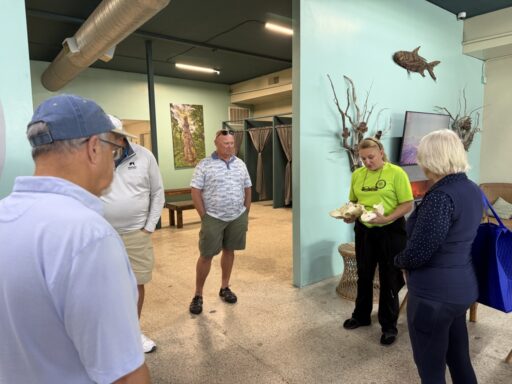 Crystal River food tour guests stopping at Explorida to explore the manatee-themed gift shop and meet the knowledgeable local team