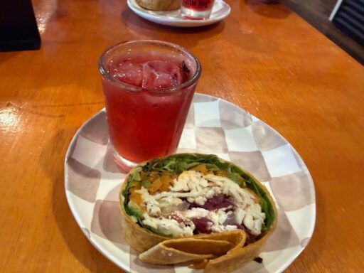 Guests enjoying a seasonal tasting menu with passion tea and a middle eastern inspired starter at Cattle Dog Coffee Roasters on a Crystal River food tour