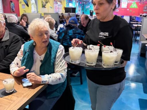 Guests from The Villages enjoying piña coladas at Bayside Seafood Grille on a Crystal River food tour