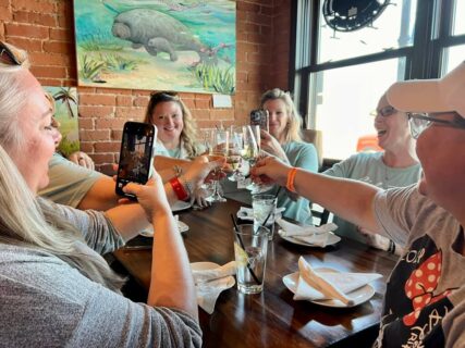 Group of women traveling to Crystal River for manatee season enjoying a local food tour experience
