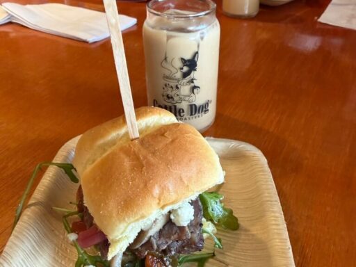 Guests enjoying a World Food Championships winning sandwich featured on the seasonal menu at Cattle Dog Coffee Roasters on a Crystal River food tour