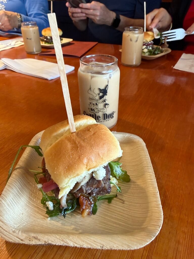 Guests enjoying a World Food Championships winning sandwich featured on the seasonal menu at Cattle Dog Coffee Roasters on a Crystal River food tour
