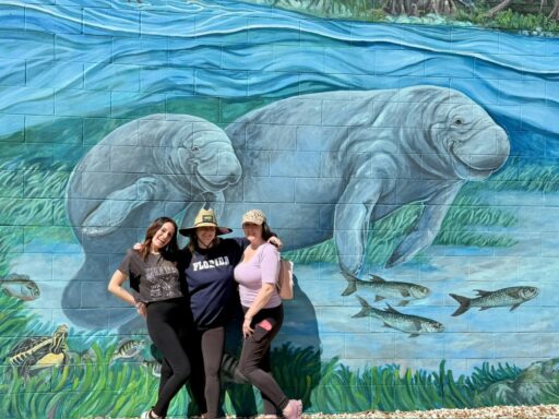 Friends posing for photos during a Crystal River food tour