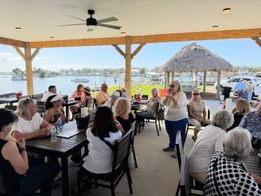 Crystal River food tour guests at Kings Bay waterfront near the Crab Plant listening to a local historian